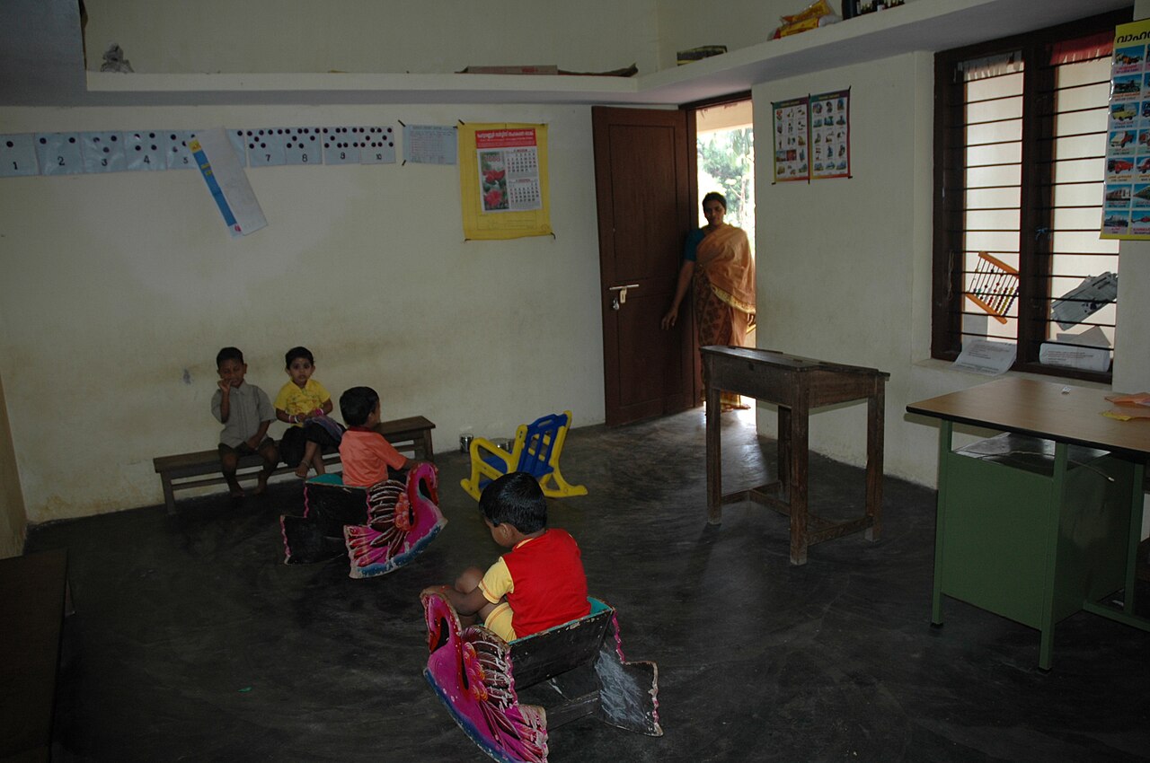 An anganwadi worker with children at a centre in Kozhikode, Kerala